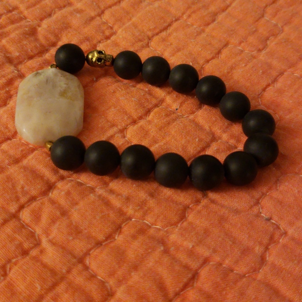 Stretch black and gold bracelet.
